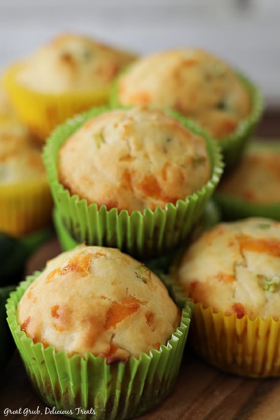 Jalapeno Cheese Muffins are easy and delicious muffins that make the perfect side for soups and chilis. A close up picture of Jalapeno Cheese Muffins stacked on top of one another.