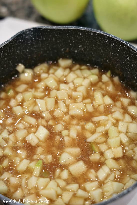 Apple Cream Cheese Egg Rolls has a delicious homemade apple filling. A pan with the homemade apple filling inside.