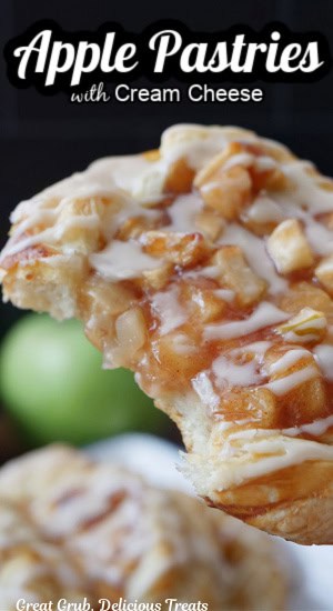 An apple pastry held up with a big bite taken out of it, and the title of the recipe is at the top of the picture.