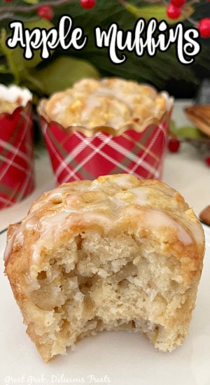 Apple Muffins with Glaze are a great muffin recipe to make when you’re craving a sweet treat, or making a breakfast for your kids. A muffin with a bite taken out of it sitting on a white plate.