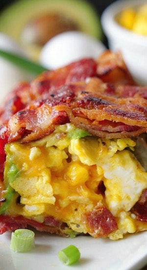 Bacon Breakfast Roll Ups A bacon breakfast roll up on a white plate.