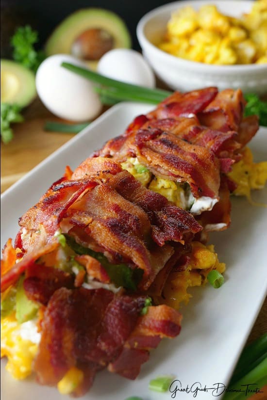 Bacon Breakfast Roll Ups The whole bacon breakfast roll up on a white plate.