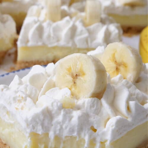 A close up of a banana bar with a bite taken out of it.