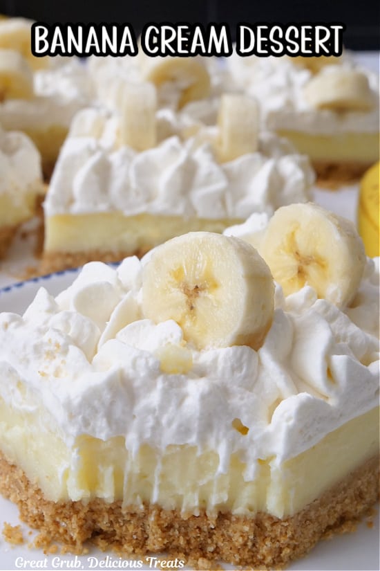 A close up of a banana bar with a bite taken out of it.