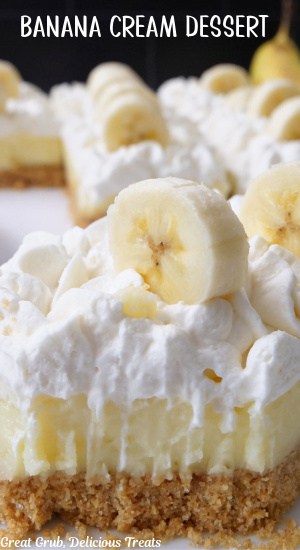 A close up of a banana bar with a bite taken out of it.