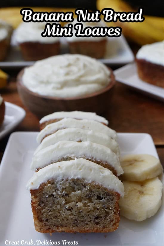 A white plate with a mini banana nut bread loave on it that has been sliced into bite-size pieces.