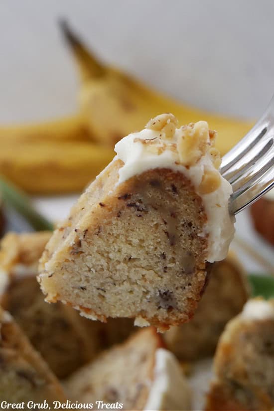 A bite of banana nut cake on a fork.