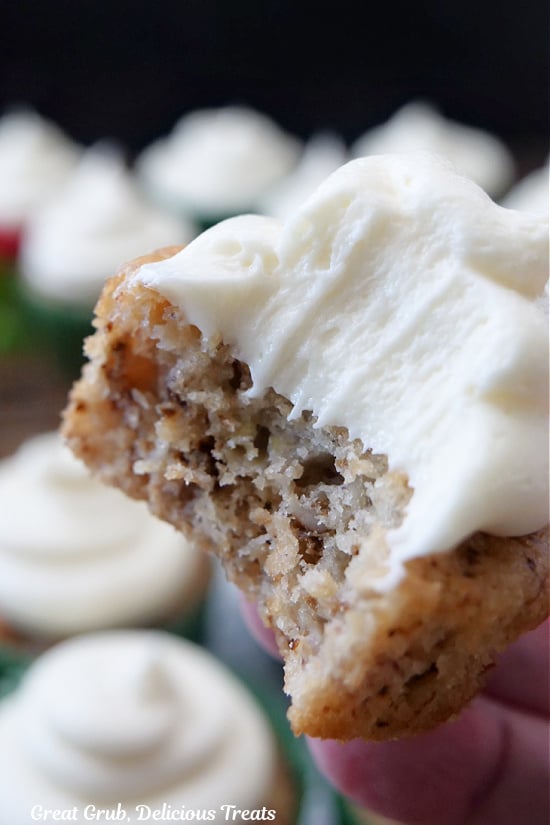 A banana muffin with a bite taken out of it.