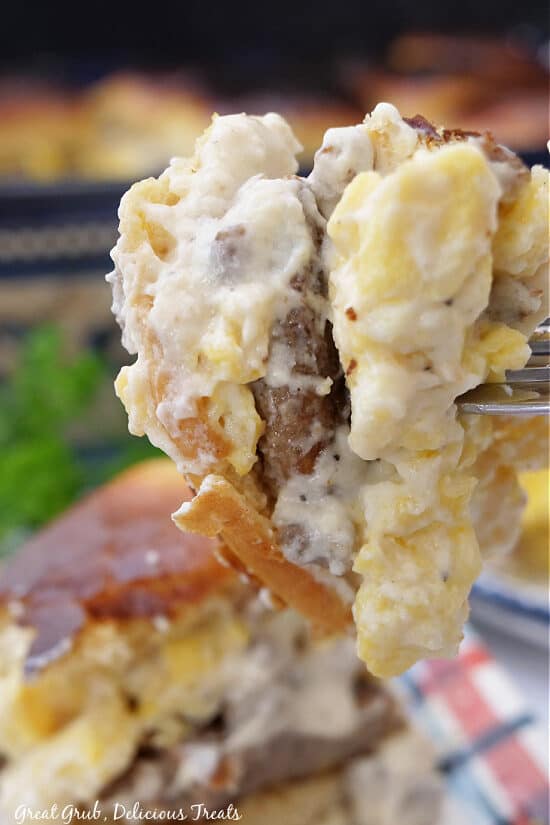 A bite of a slider on a fork.