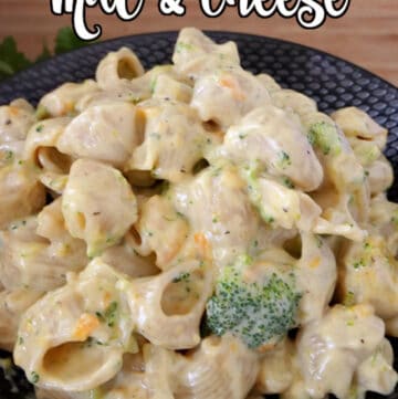 A black bowl with Cheddar Broccoli mac and cheese in it.