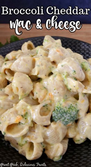 Broccoli Cheddar Mac and Cheese is a great recipe to make as a side dish or have as a main meal. Creamy broccoli mac and cheese in a black bowl.