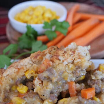 A white plate with cheddar bay cheesy beef pot pie on it.