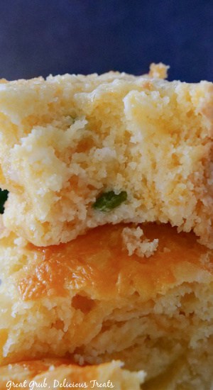 Cheesy Cornbread is the best cornbread that the family will definitely enjoy. Two slices of cornbread stacked on top of each other.