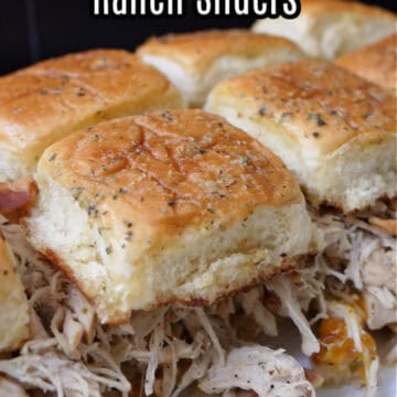 A white plate with a close up of a half a dozen chicken sliders on it with the title of the recipe at the top of the photo.