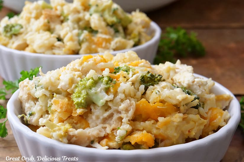 A horizontal photo of rice, broccoli, chicken and cheese casserole.