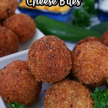 A white plate with a stack of chicken cheese bites.
