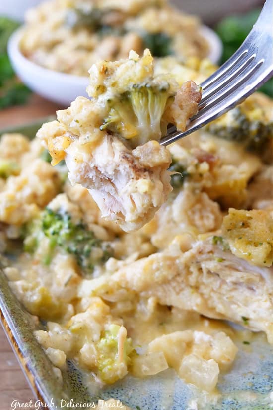 A bite of chicken casserole on a fork.