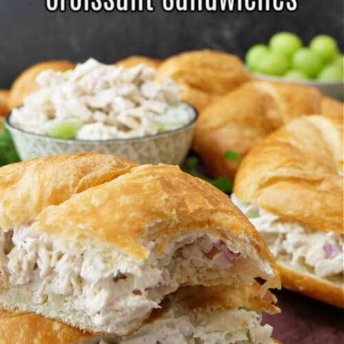 A title picture with a chicken salad sandwich cut in half and stacked up on top of each other.