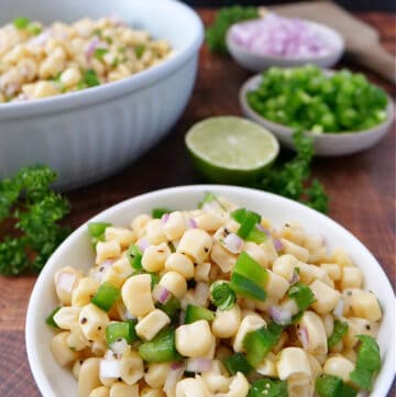 A title at the top of the picture with two bowls filled with Chipotle corn salsa.
