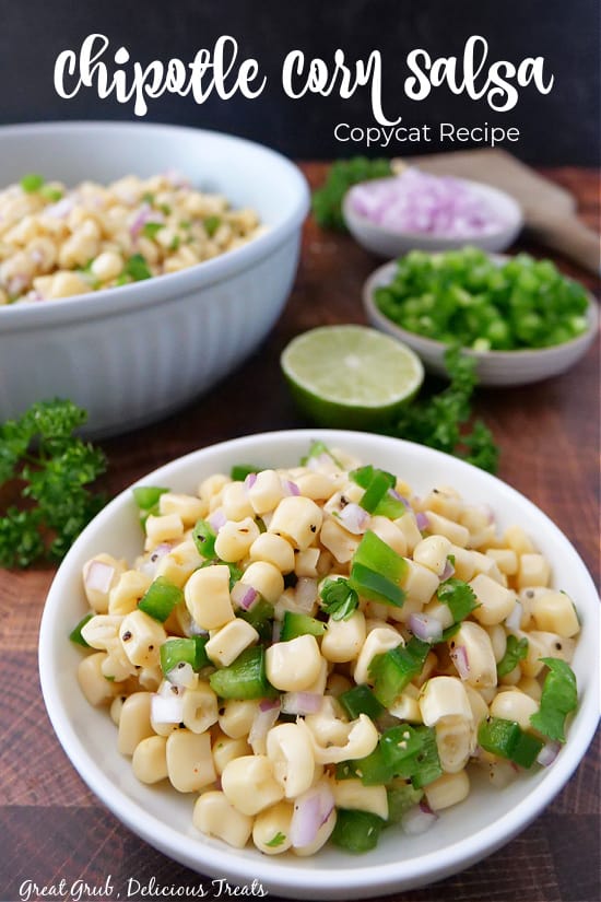 A title at the top of the picture with two bowls filled with Chipotle corn salsa.