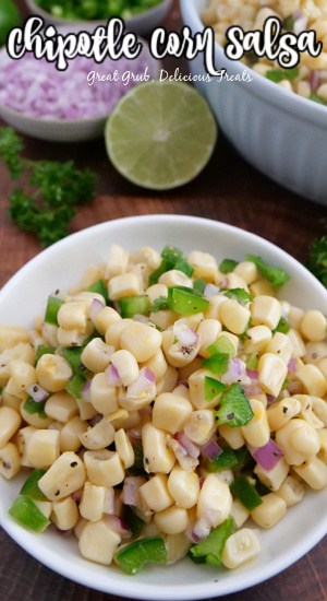 Chipotle Fresh Tomato Salsa is a delicious recipe to put on top of burritos, tacos, or to just eat with chips. An overhead photo of corn salsa in a white bowl.