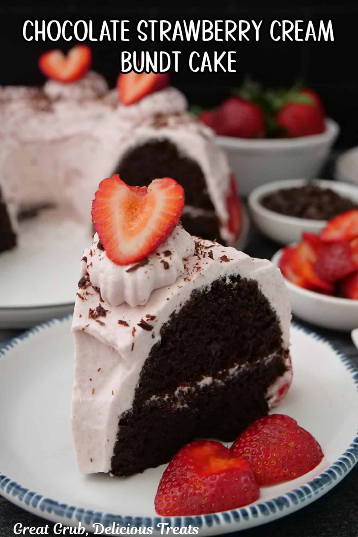 A round white plate with blue trim with a slice of chocolate strawberry cream bundt cake on it with more cake in the background.
