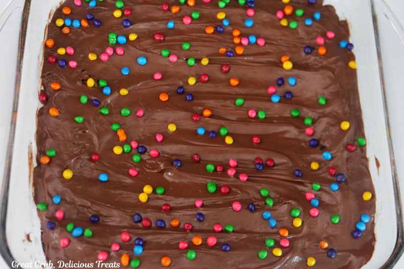 A glass baking dish with frosted cosmic brownies in it.