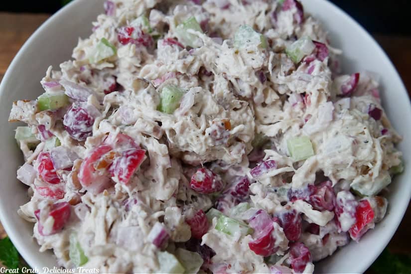A white bowl filled with homemade cranberry pecan chicken salad.