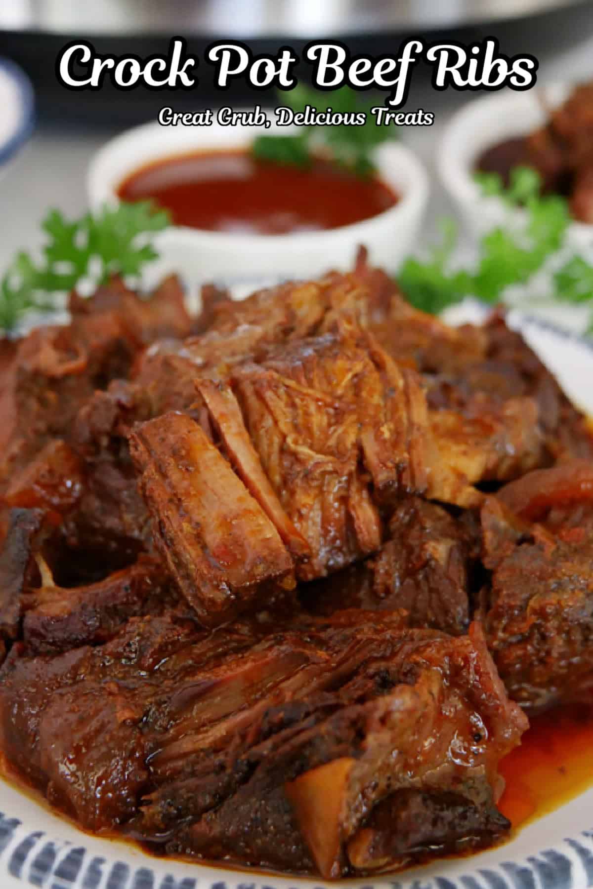 Boneless beef ribs on a white plate with blue trim, and the title of the recipe at the top.
