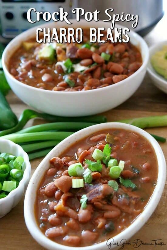 Two white bowls filled with crock pot spicy charro beans.