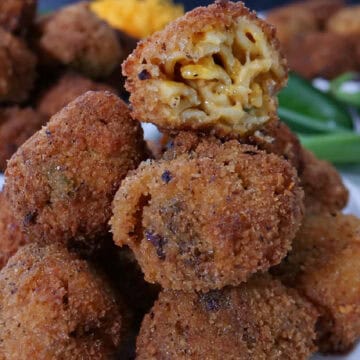 A stack of deep fried mac and cheese bites on a white plate with the title overlay at the top.