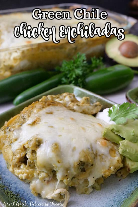 A green square plate with a serving of chicken enchilada casserole on it.