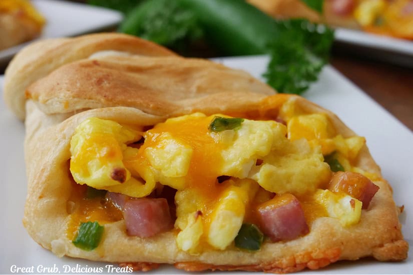 A breakfast crescent on a white plate.
