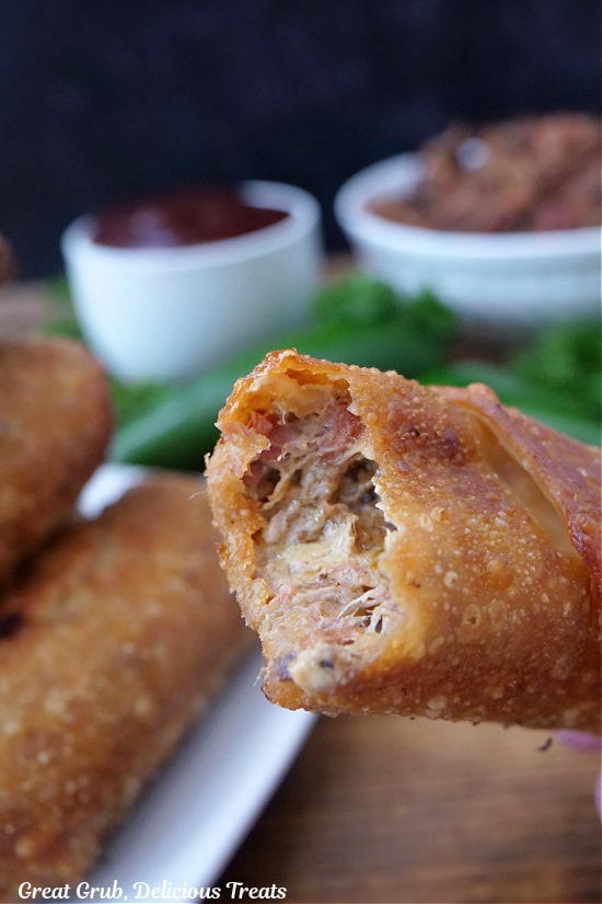 A bite taken out of a fried egg roll.