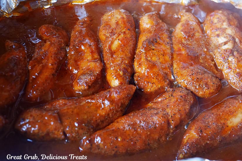 A foil pouch opened up showing the smoked chicken strips.
