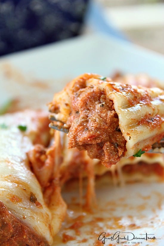 Lasagna Stuffed Manicotti A bite of lasagna stuffed manicotti on a fork.