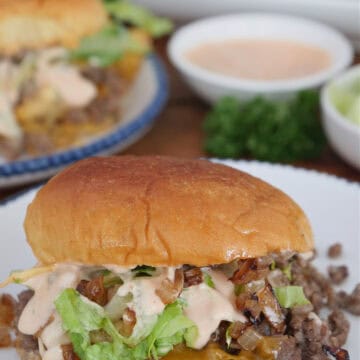 A white round plate with blue trim with a In N Out slider on it with a title overlay at the top.