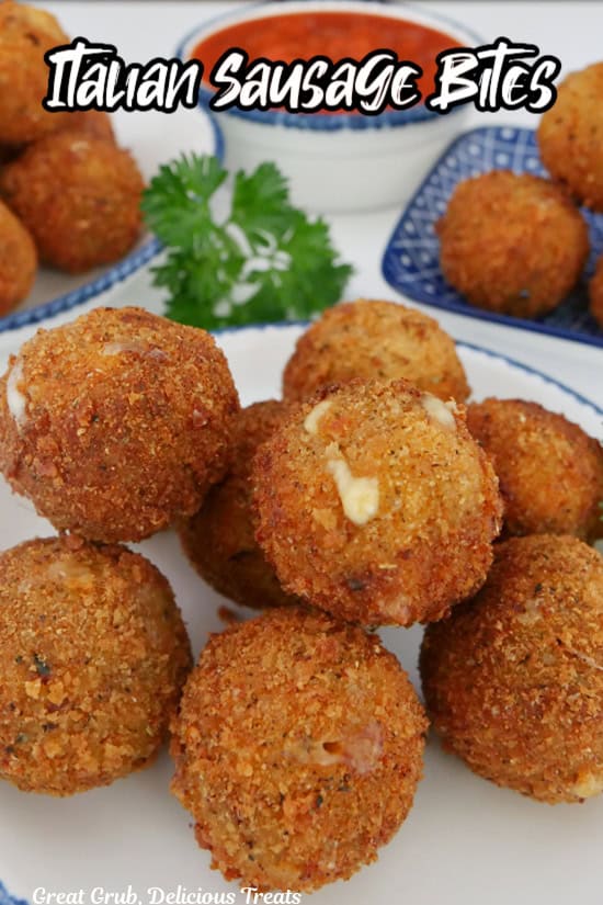 A white surface with eight Italian sausage bites on a white plate with blue trim and the title of the recipe in text at the top. 