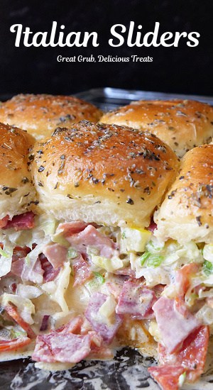 A baking dish with Italian sliders in it showing all of the ingredients.