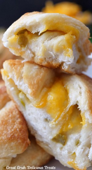 A close up of three slices of jalapeno cheddar bread stacked on top of each other.