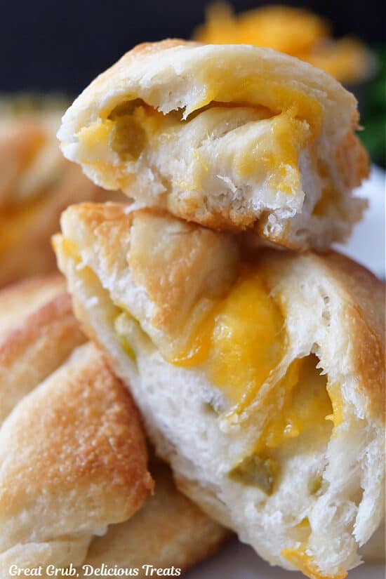 A close up of three slices of cheese bread on top of each other.