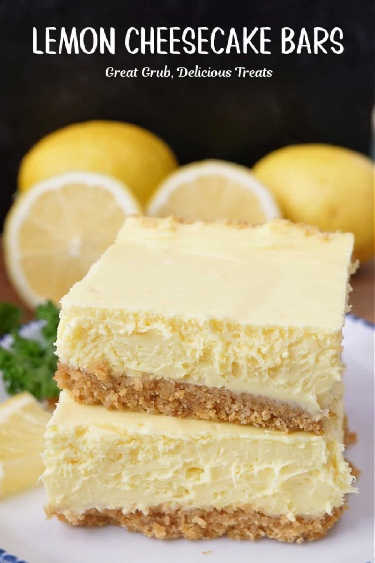Two lemon cheesecake bars stack on top of each other placed on a white plate.