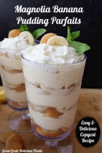 Two tall parfait glasses filled with banana pudding, vanilla wafers and sliced bananas.