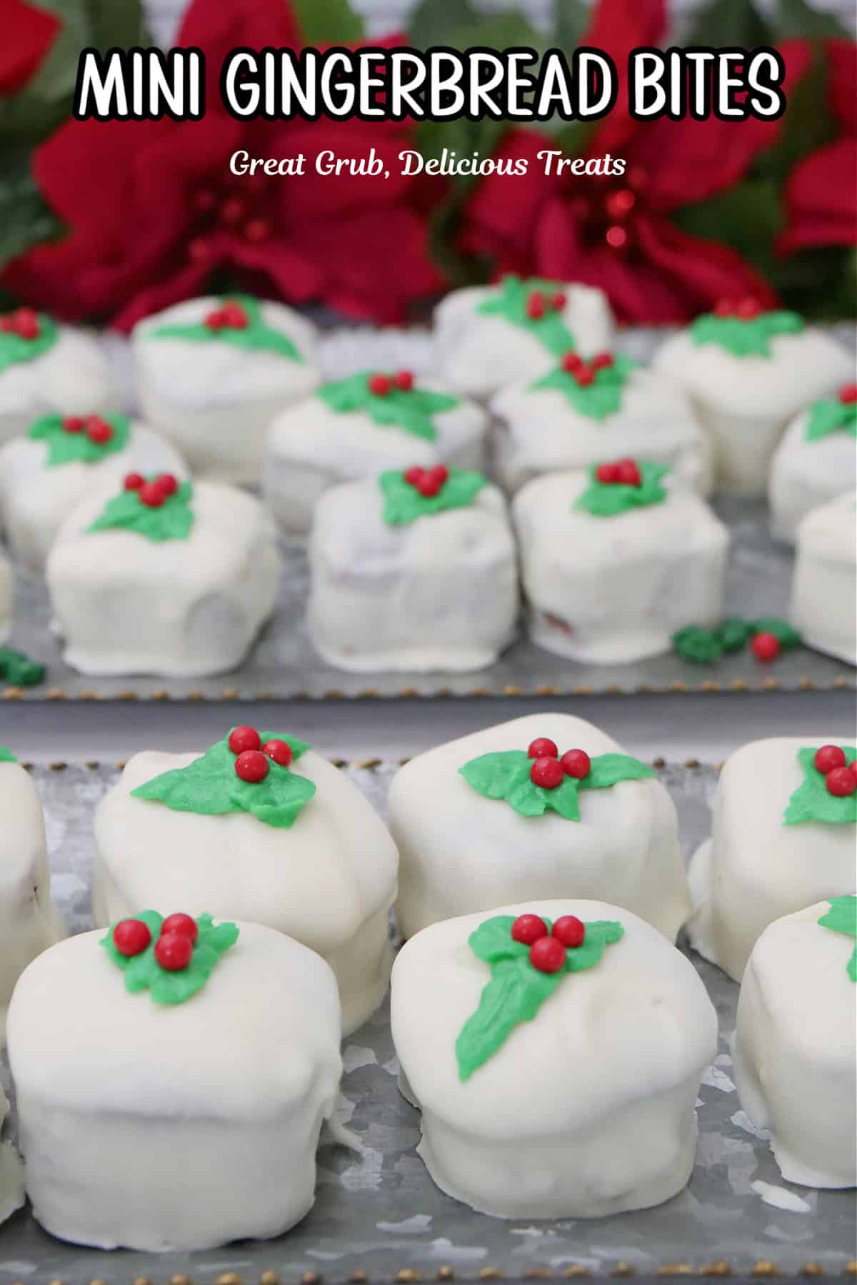 Two sliver trays with mini gingerbread bites covered in white chocolate and green and red decorations on top of each one.
