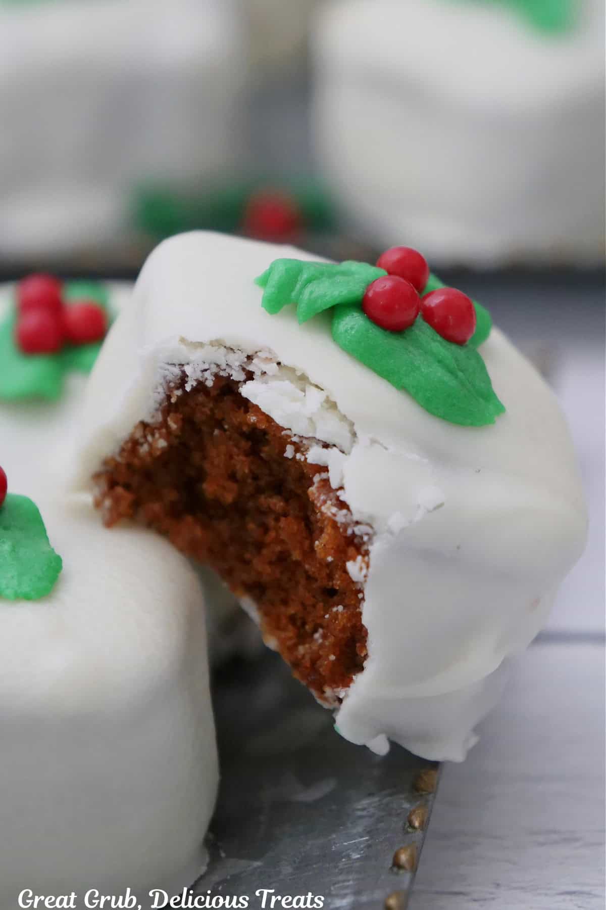 A gingerbread bite with a bite taken out of it.