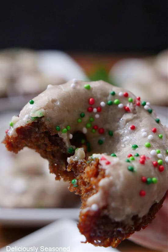 A mini gingerbread cake with a bite taken out of it.
