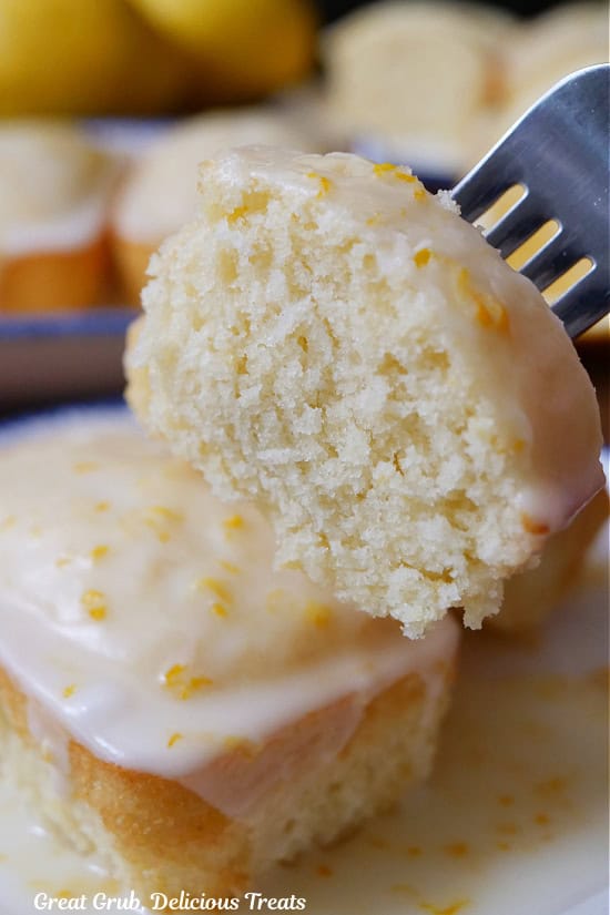 A bite of a mini lemon loaf on a fork.