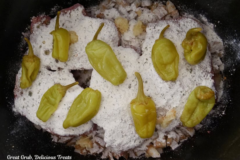 Nine pepperoncinis added on top of the pork chops.