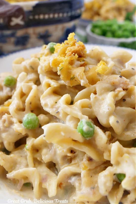 A white bowl with a serving of homemade tuna noodle casserole in it.