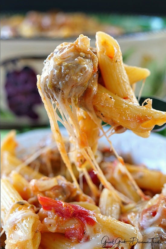 Italian Sausage Penne Casserole A bite of pasta on a fork showing all the cheesy goodness.